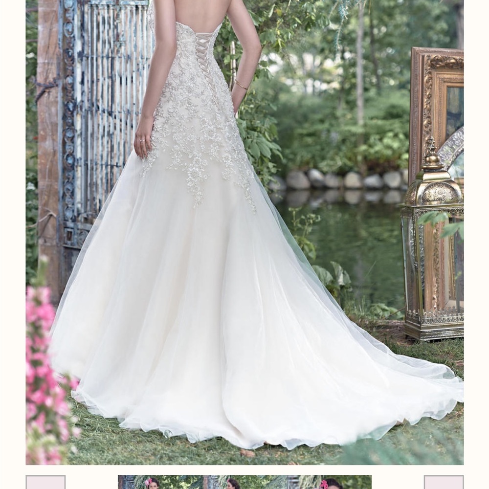 Maggie Sottero Ivory Ball Gown with Silver Beaded Bodice - Picture 9 of 11